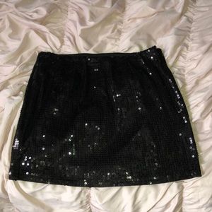 Black sequined skirt.